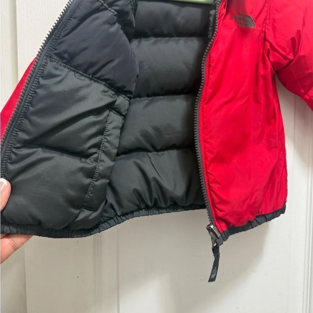 The North Face Kids Black and Red Puffer Jacket. Two-sided black and red